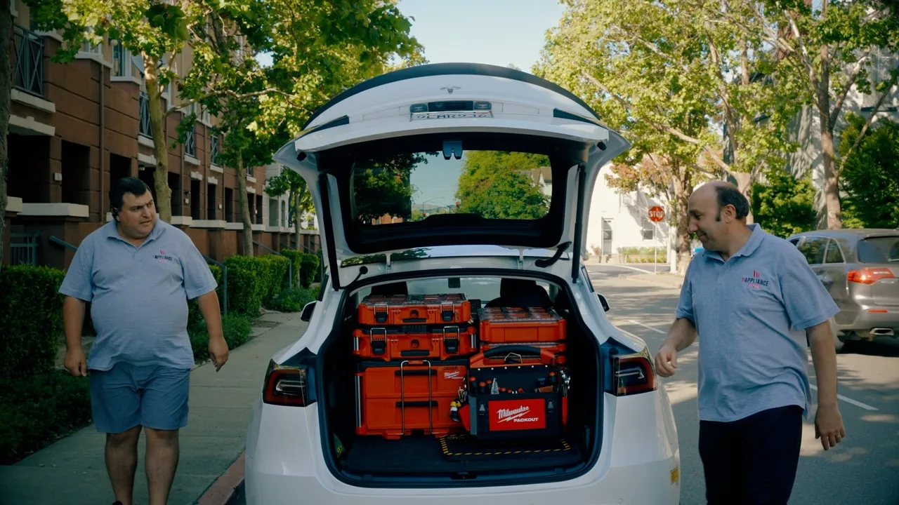 Top Appliance Repair technicians loading the service van in a Bay Area driveway